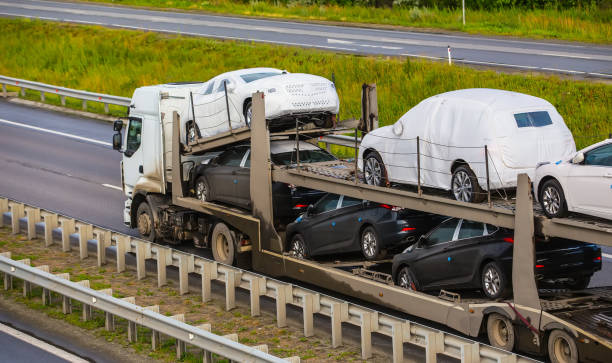 transportation of car on semi-trailer on country highway